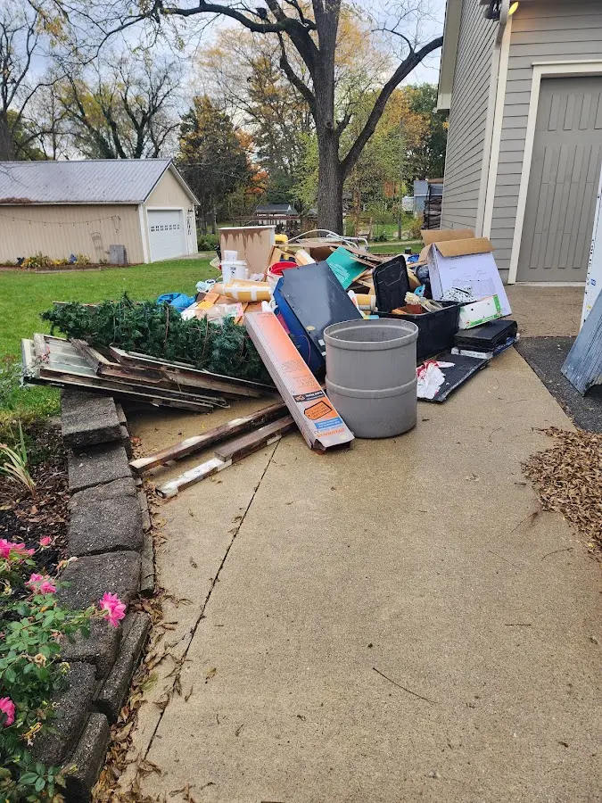 Dumpster being loaded with debris for Demolition Dumpster Rental in Grand Saline
